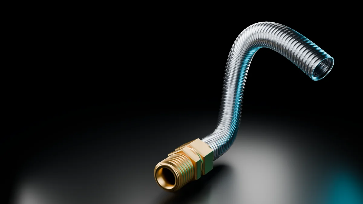 Ridgeline corrugated stainless steel tube and P1 fitting in a dark studio